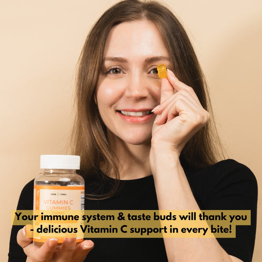 Woman holding Vitamin C supplements on beige | Herb Terra
